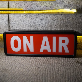 DMKYDM On Air light sign closeup showing LED glow for streams