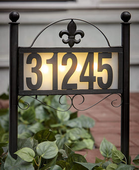 DoinMaster solar metal address sign in yard showing 50 numbers for clear nighttime visibility