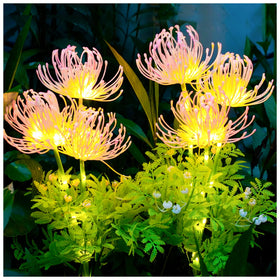 DooYard solar garden lights glow softly in flowers at night for magical outdoor ambiance.