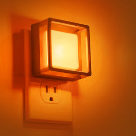DORESshop Orange Night Light 2-pack glows softly at the wall outlet for easy nighttime visibility.