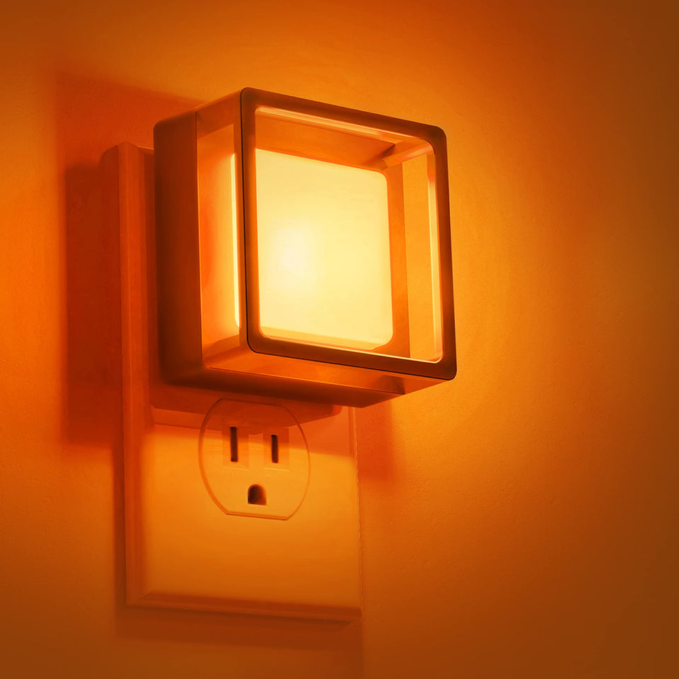 DORESshop Orange Night Light 2-pack glows softly at the wall outlet for easy nighttime visibility.