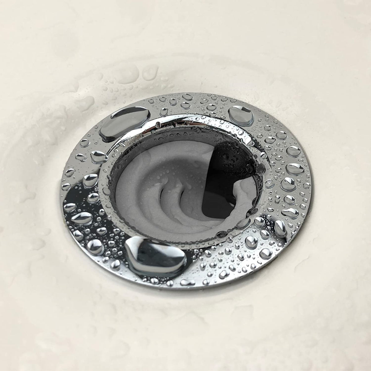 DrainFunnel close-up demonstrates the hair-diversion design preventing clogs