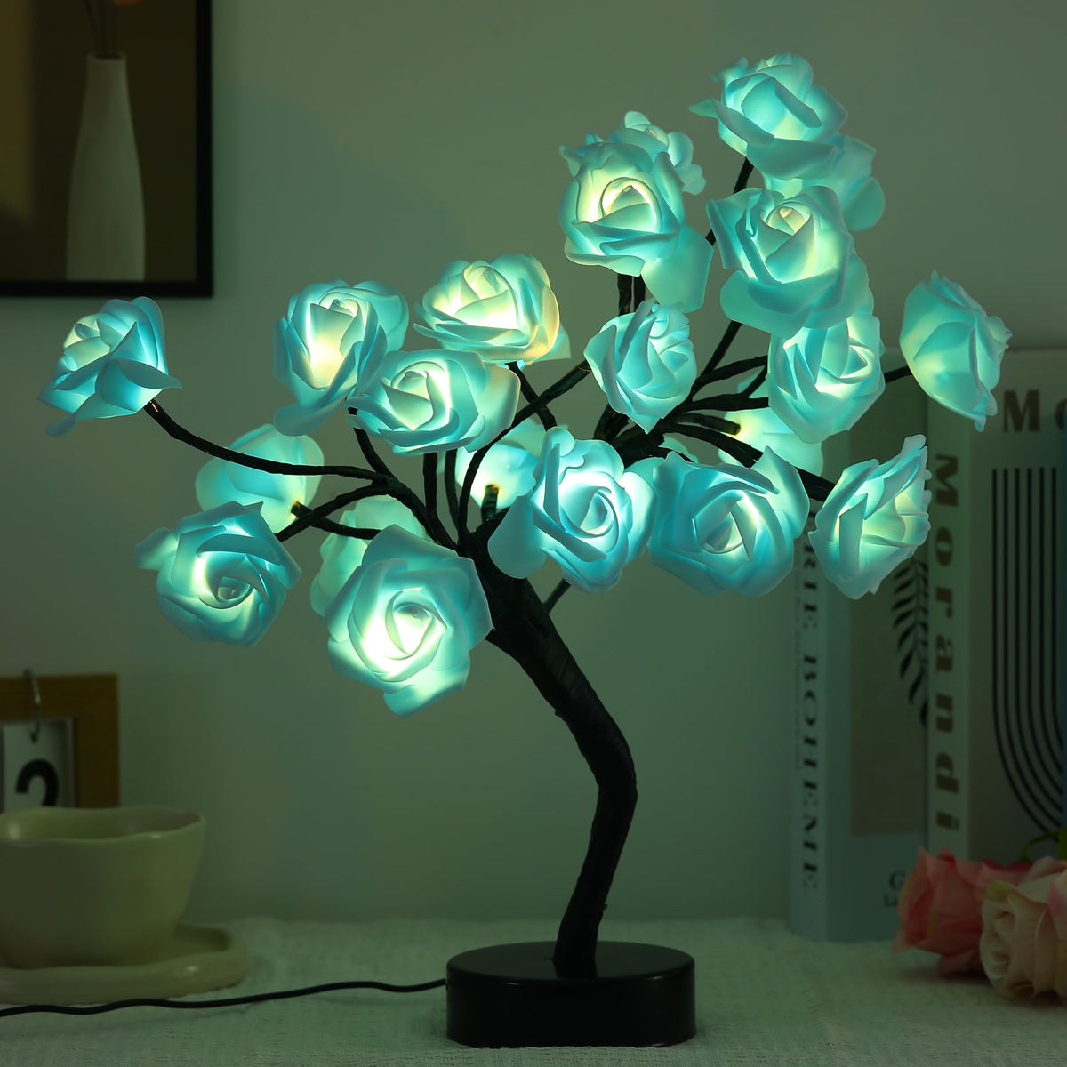 Drawelry Rose Tree Lamp with blue LED petals provides warm ambient lighting for bedrooms.