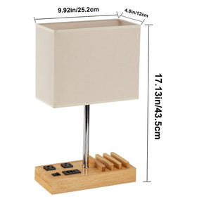 Dreamholder desk lamp with slots for phones while they charge.