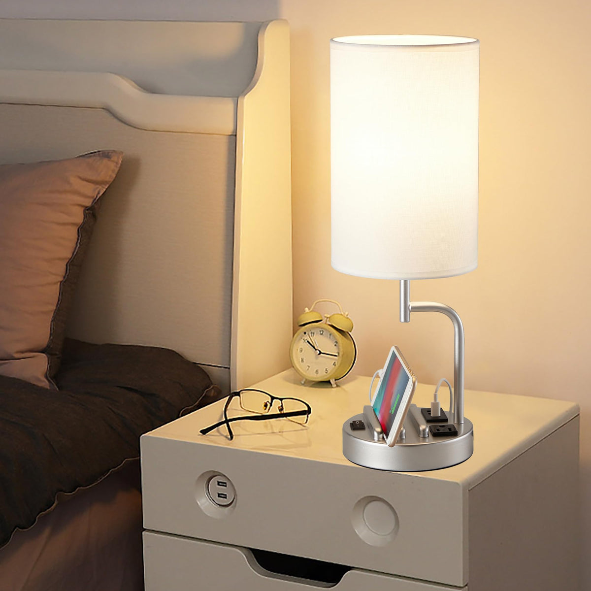 Dreamholder lamp with built-in phone slots for organized devices.