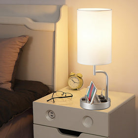 Dreamholder lamp with built-in phone slots for organized devices.