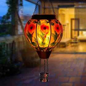 DREAMSOUL hummingbird lantern side view shows glass panels and cozy ambience