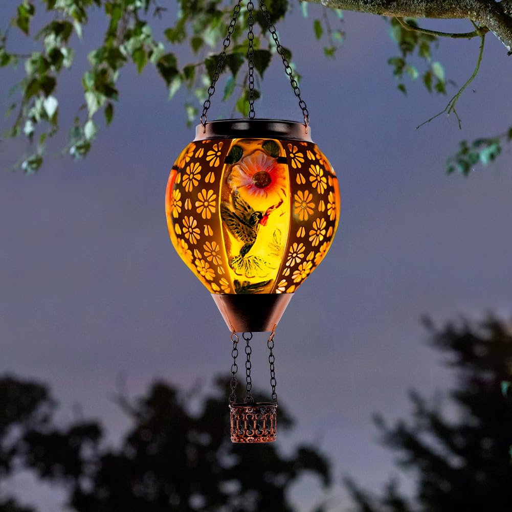 DREAMSOUL solar flame lantern with metal frame for cozy patio evenings.