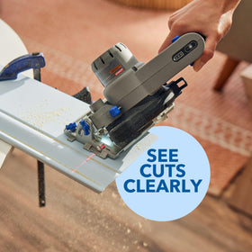 Edge guide attachment aiding straight, repeatable cuts on materials.