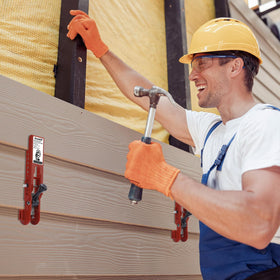 Non-slip padding protects siding while clamping during installation