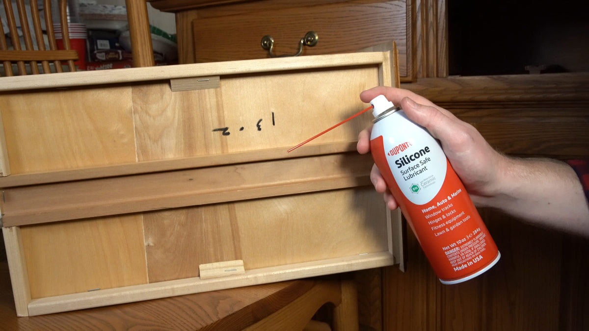 DuPont silicone lubricant nozzle close-up shows precise control for gaskets and fittings