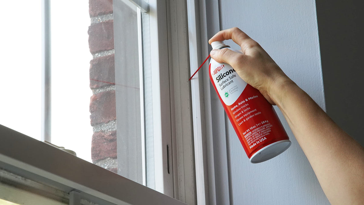 DuPont silicone lubricant spray action prevents squeaks on windows and doors