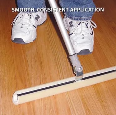 Applying floor coating with Duratool for fast, even coverage on a large area.