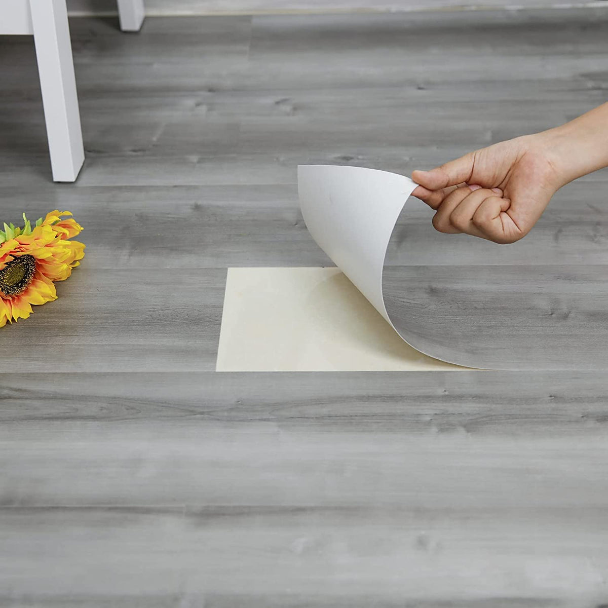 Dureidos peel-and-stick floor tile with natural grey wood grain for durable floors