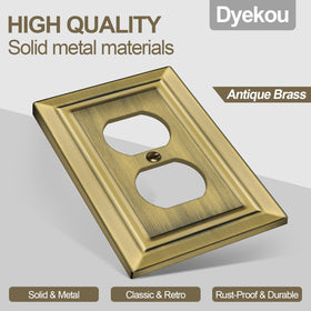 Dyekou metal switch plate in antique brass adds vintage charm.