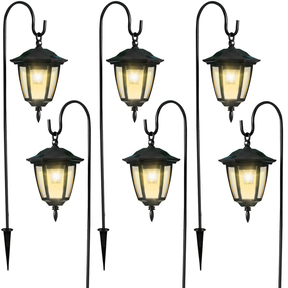 Dynaming six-pack solar hanging lanterns illuminate the garden softly at night.