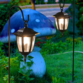 Dynaming outdoor-decor along walkway creates welcoming nighttime paths.