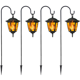 Dynaming solar flame lanterns glow along the patio at dusk for welcoming ambiance.
