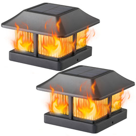 Dynaming solar flame post cap light on wood 4x4 post adds gentle garden illumination.