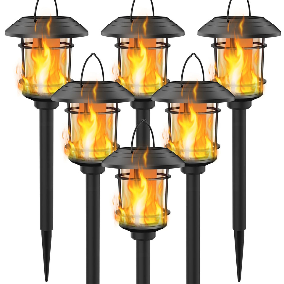 Dynaming solar flame torch on ground stake casting warm walkway glow