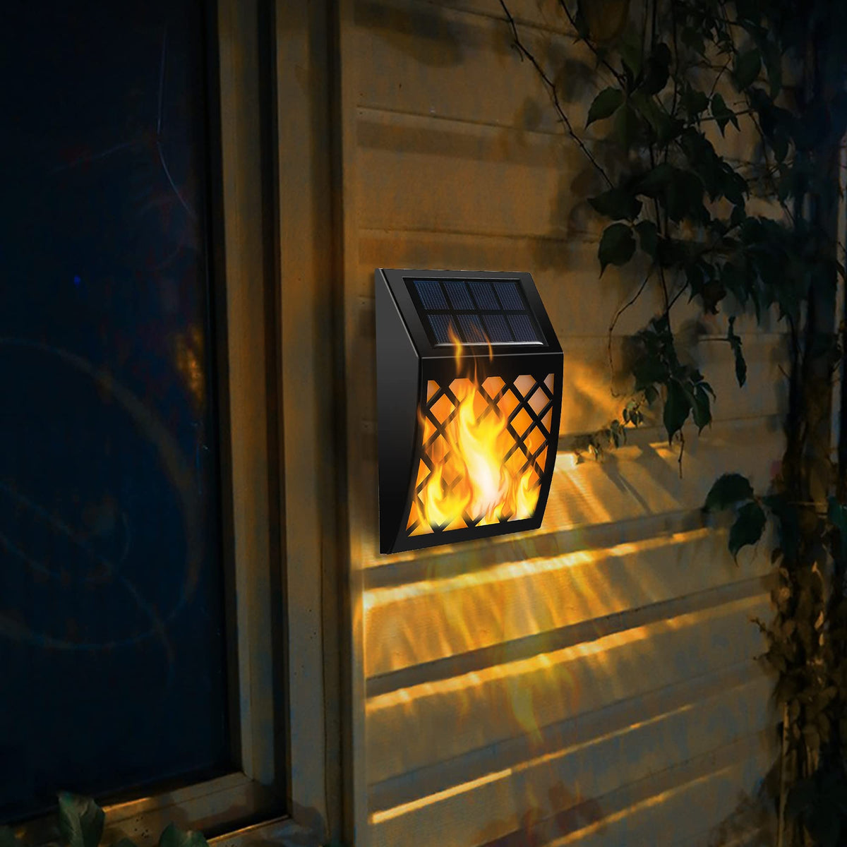 Dynaming solar flame wall light back view reveals solar panel for charging.