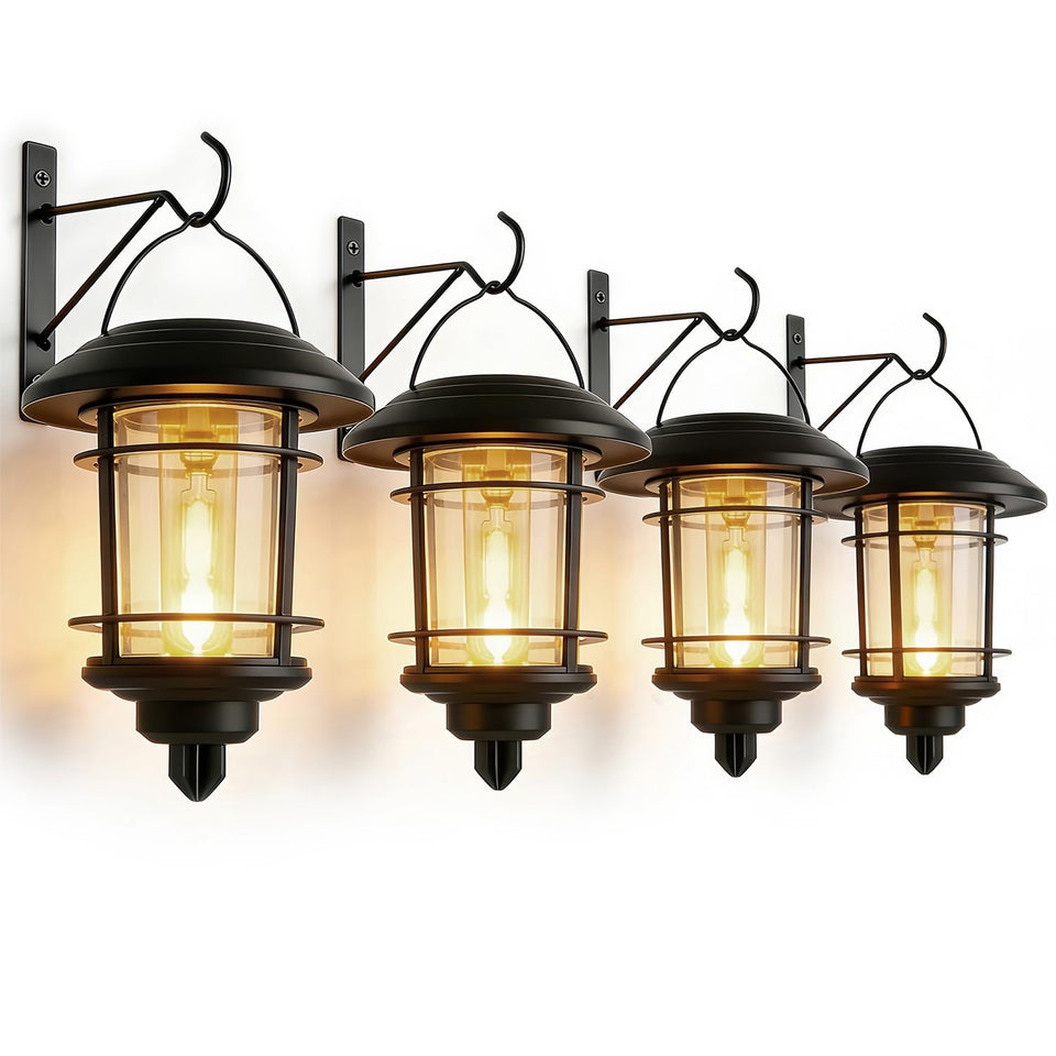 Dynaming solar lantern wall-mount four-pack illuminating a porch with warm glow