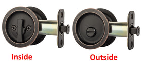 Pocket door latch installation being performed with a screwdriver