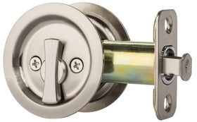 Dynasty Hardware pocket door latch, round privacy design for interior bedroom or bathroom.