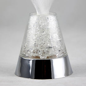 Compact lamp powered by three AAA batteries for cordless placement.
