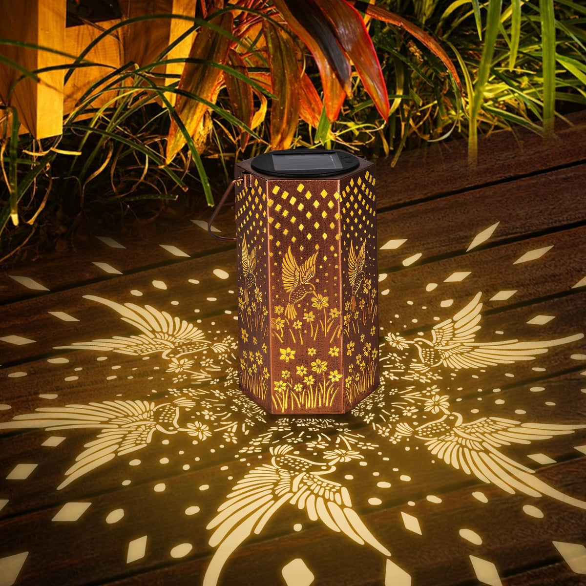 Eandisom garden path illuminated by hummingbird lanterns at dusk