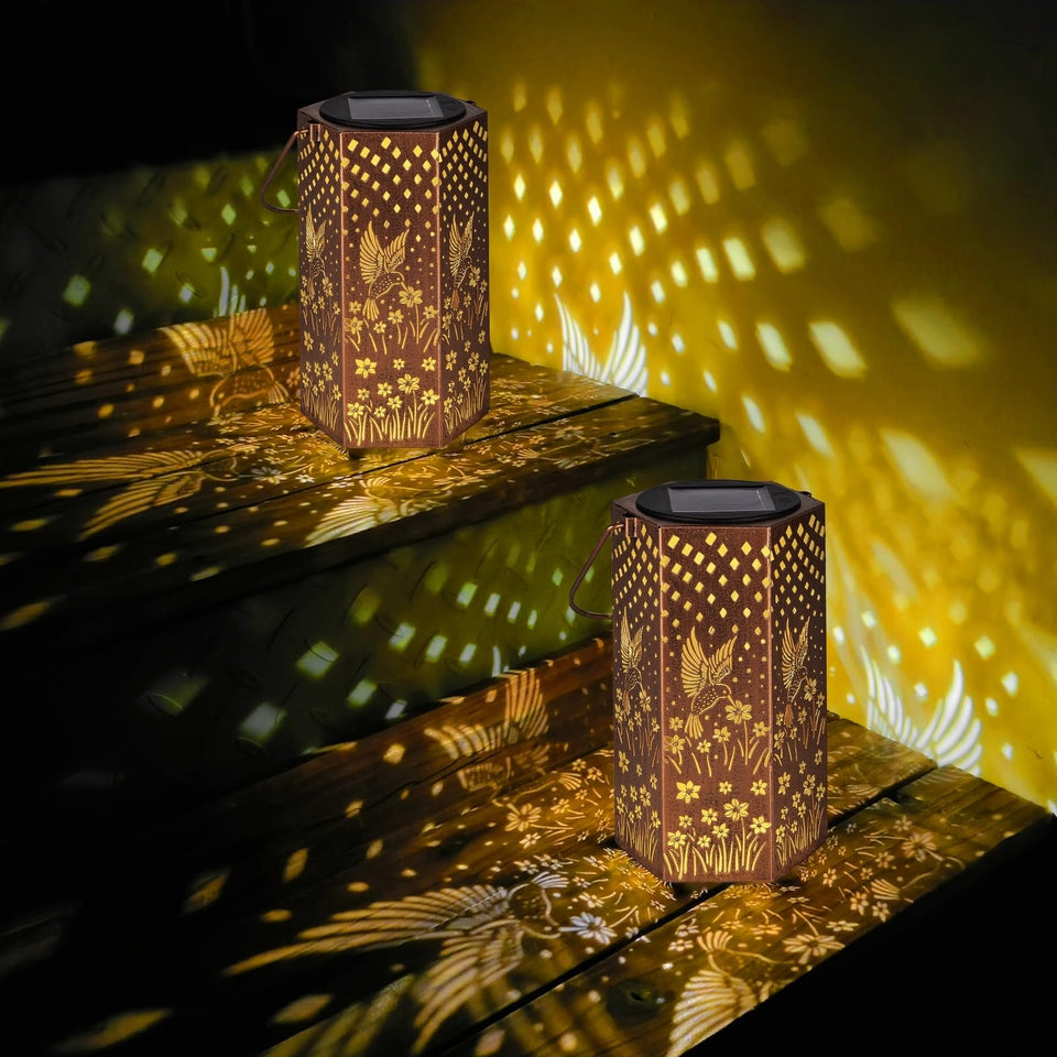 Eandisom hummingbird solar lantern hanging casts warm glow in garden