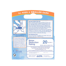 A child wearing EarPlanes Plus to help regulate cabin pressure on ascent