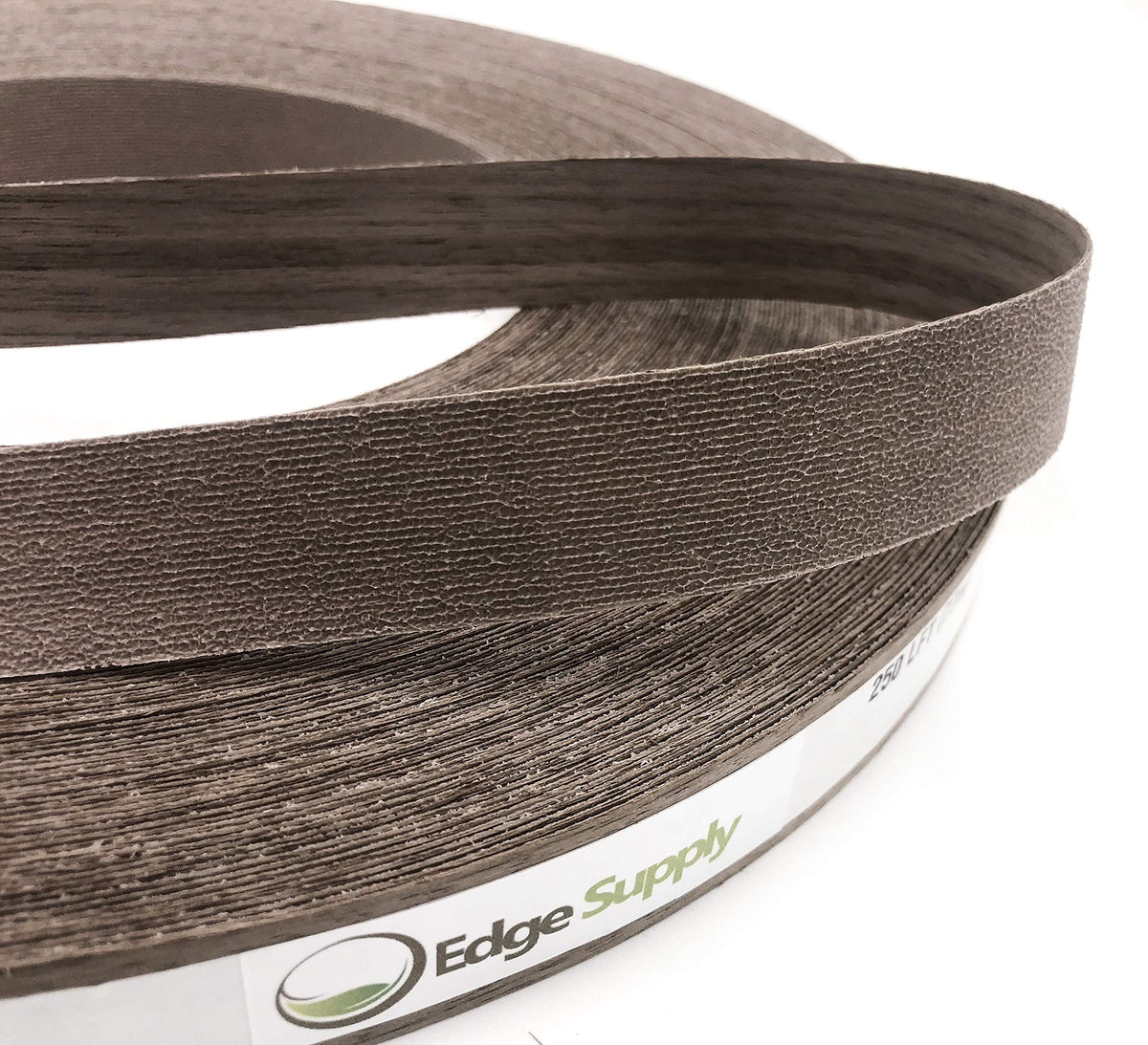 Edge Supply Walnut veneer tape being trimmed for precise edge fit