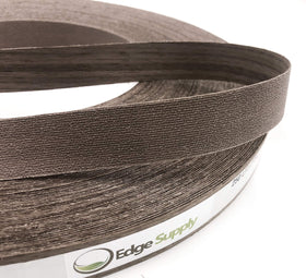Edge Supply Walnut veneer tape being trimmed for precise edge fit