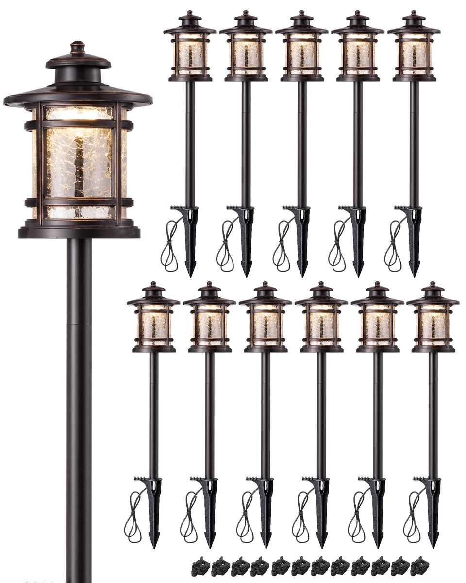 EDISHINE low-voltage pathway light with bronze finish illuminating a garden edge