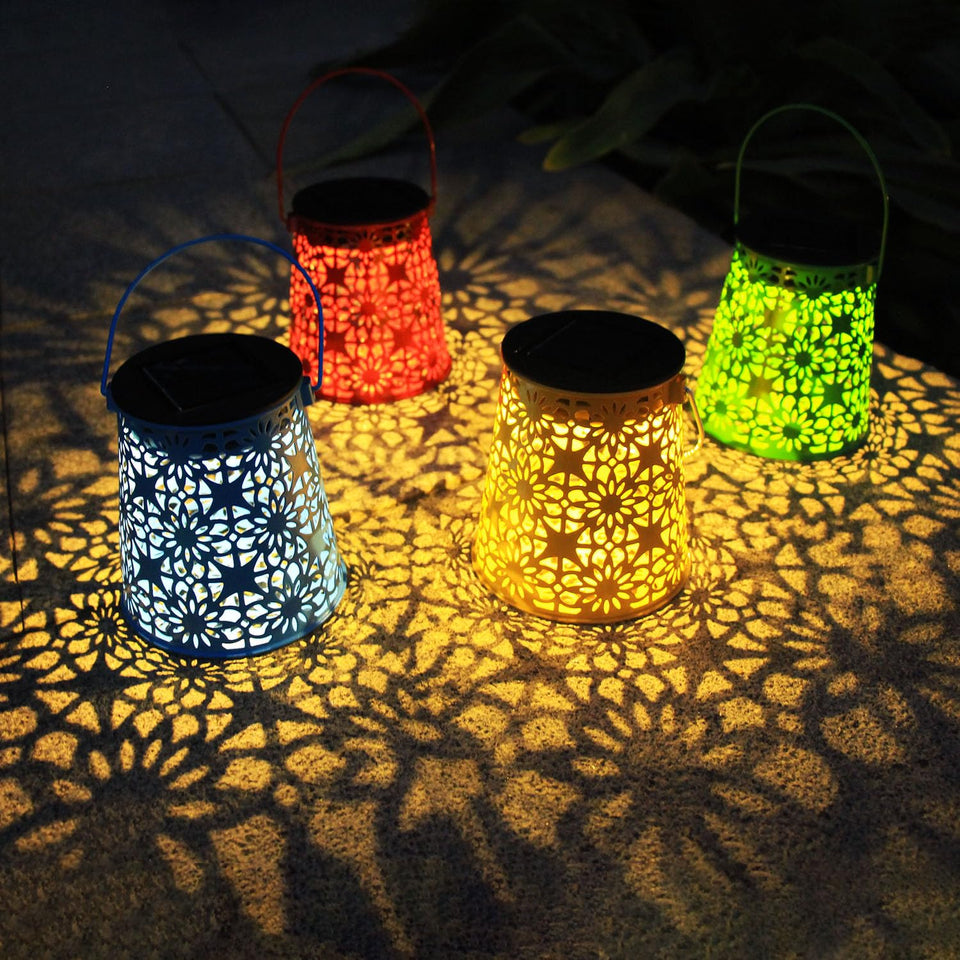 Eigreen solar lanterns cast decorative patterns at dusk for a tranquil garden ambiance.