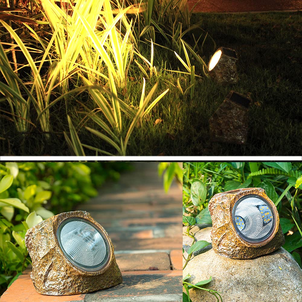 EiGreen rock light installed on ground along a walkway for durable outdoor lighting.