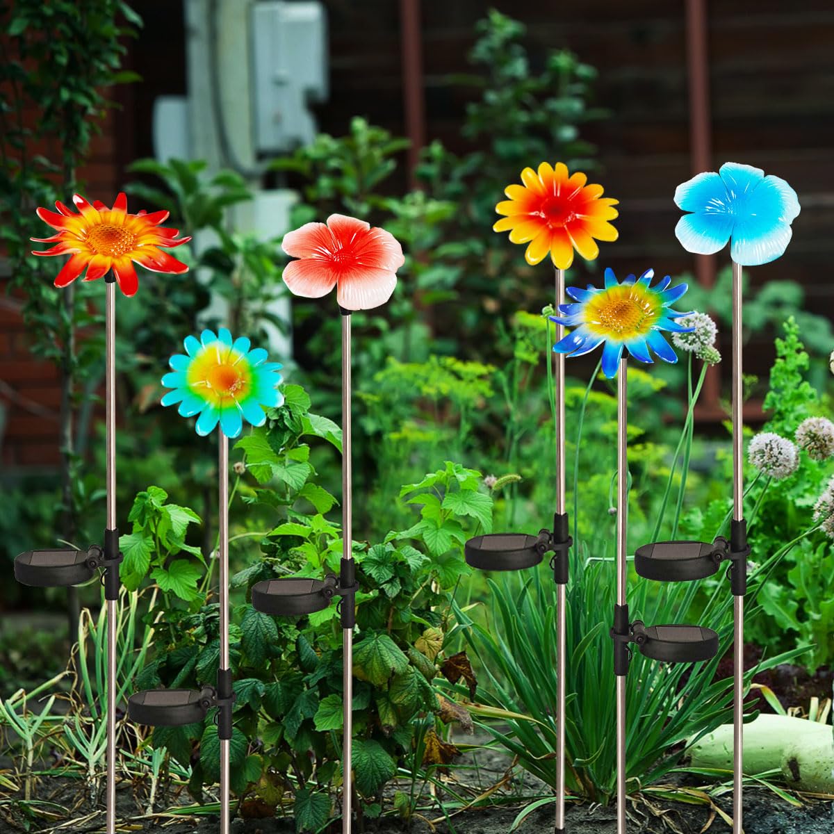 EiGreen stake light installation shows easy setup on soft ground with direct sunlight.