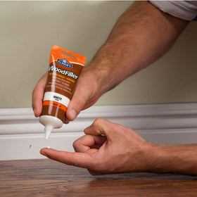 Elmer's E855 white wood filler tube dispensing demo for holes and cracks.