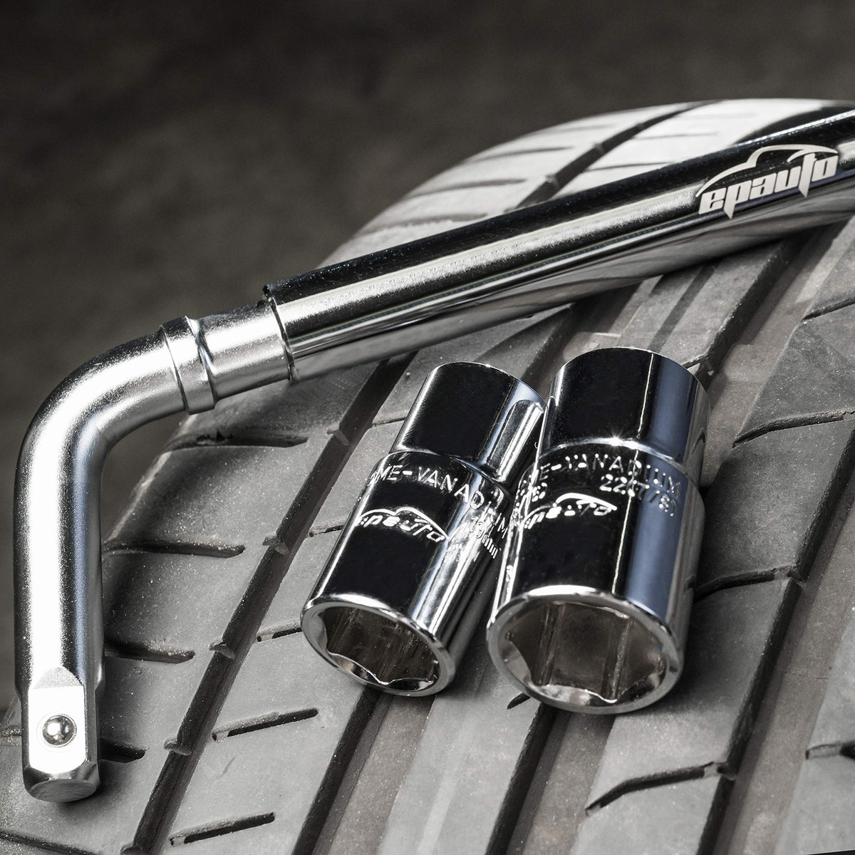 EPAuto lug wrench in use on a wheel to tighten lug nuts quickly.