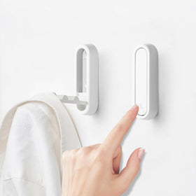 Eptcp foldable wall hook white, folded flat for space-saving storage.