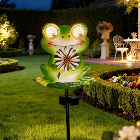 EsGarden LEDs Dynamic Eyes solar frog stake glows at night, adding whimsy to your garden.
