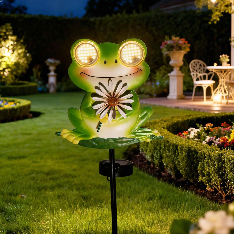 EsGarden LEDs Dynamic Eyes solar frog stake glows at night, adding whimsy to your garden.