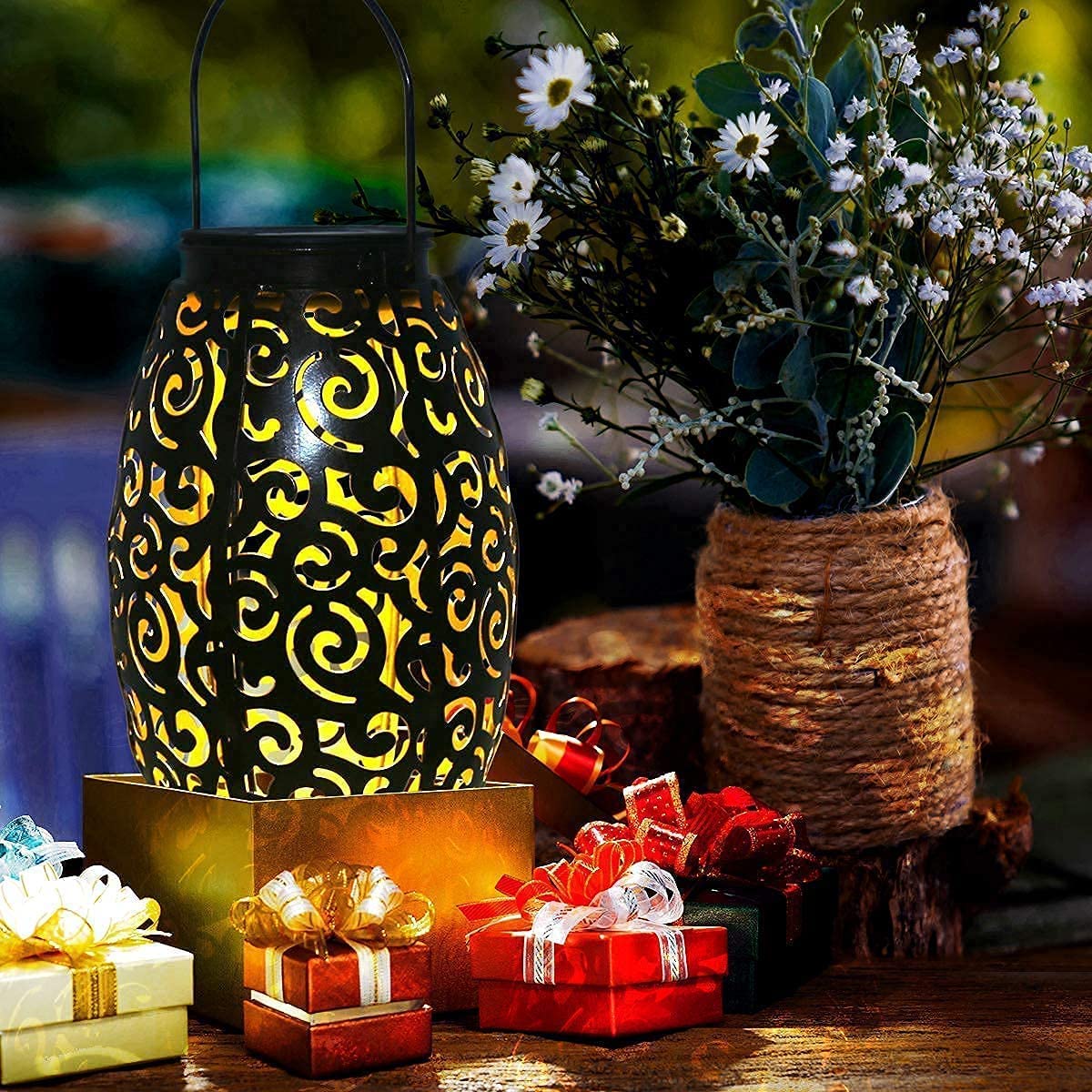 esgarden solar outdoor lantern hangs from tree for warm ambiance