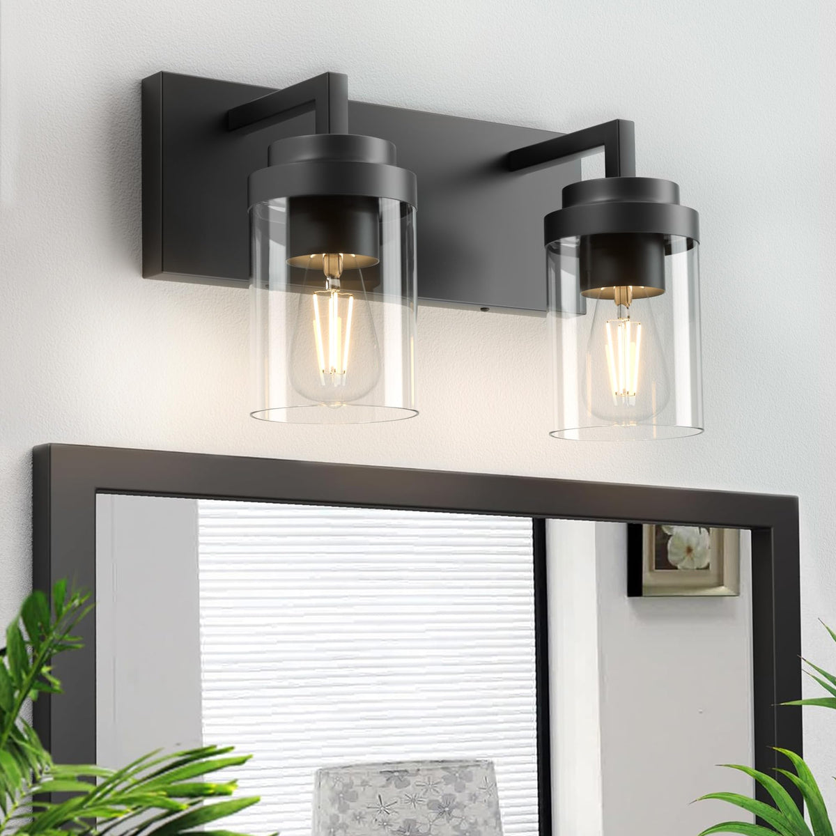 Espird vanity light with clear glass shade brightens mirrors and enhances a modern farmhouse look.