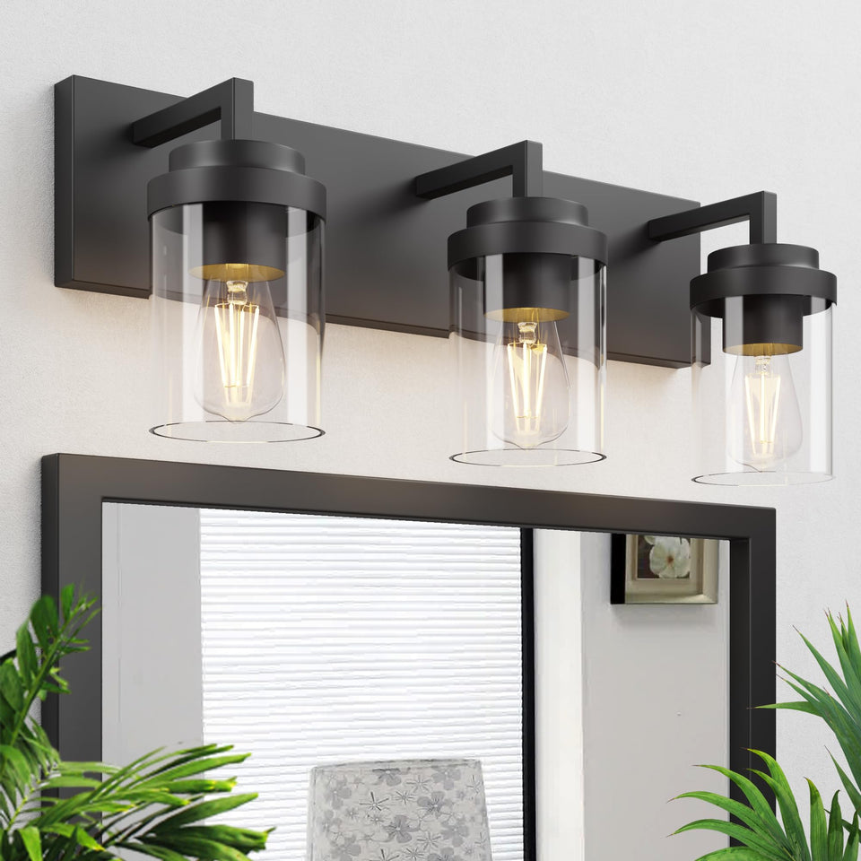 Espird vanity light with three matte black fixtures for a modern bathroom ambiance.