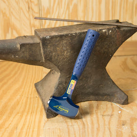 Estwing drilling hammer in action on a job site for precise, heavy blows.