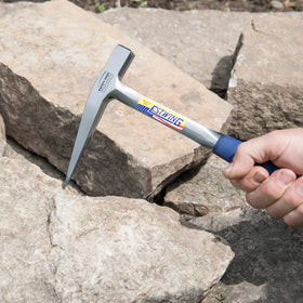 Geology tool in use on-site by professionals using Estwing Rock Pick.