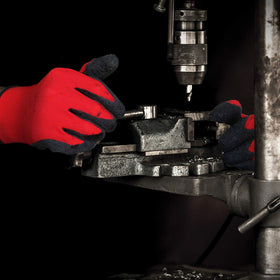 Evridwear large size gloves on a worker’s hand in red