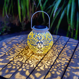 EXCMARK metal lantern with rustic finish adds yard charm